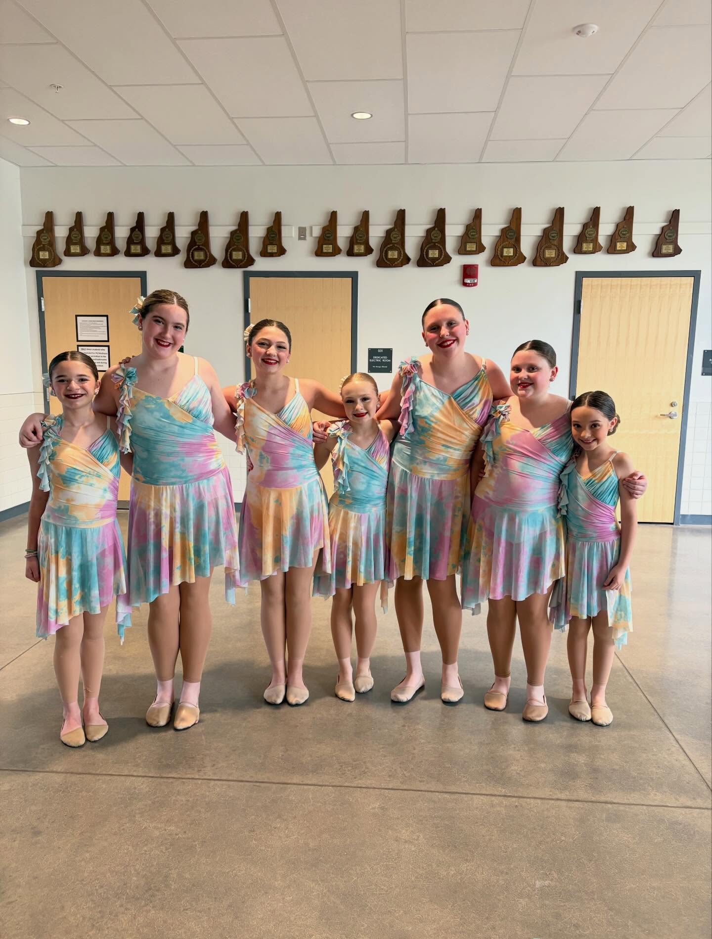 L.A. Dance students posing together in colorful pastel costumes